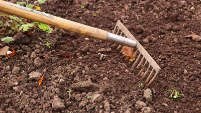 A gardener's checklist for preparing soil before planting vegetables, herbs, and flowers in a garden bed.